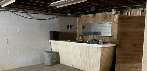 a bathroom with a sink a mirror and shower