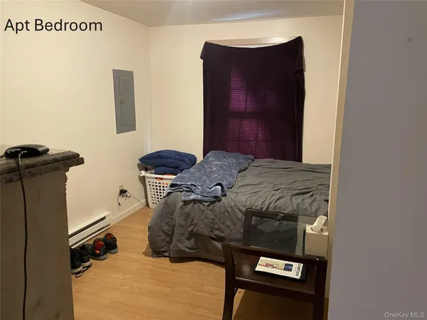 a bed sitting in a bedroom next to a wooden cabinet