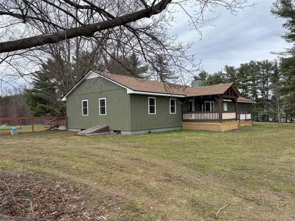 a house with trees in the background