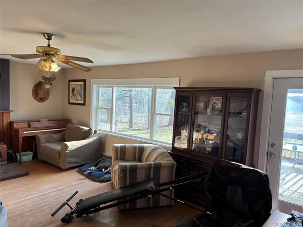 a living room with furniture and a window