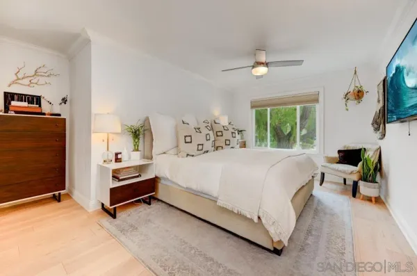 a bed room with a bed and a tv