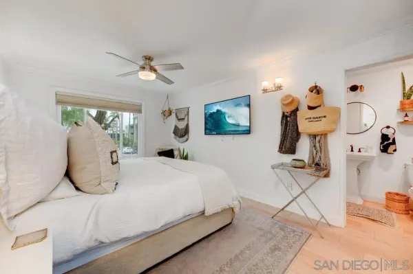 a bedroom with bed and window