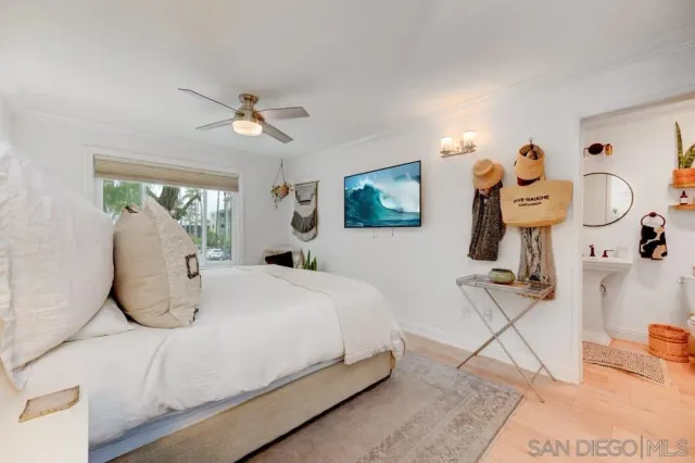 a bedroom with bed and window