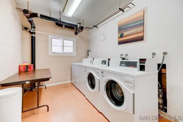 a utility room with dryer and washer