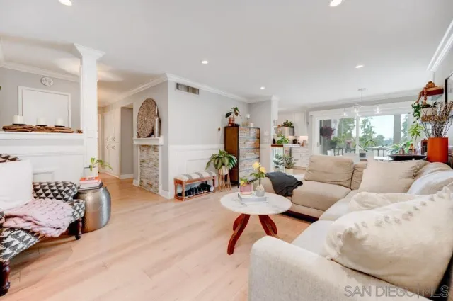 a living room with furniture and a lamp