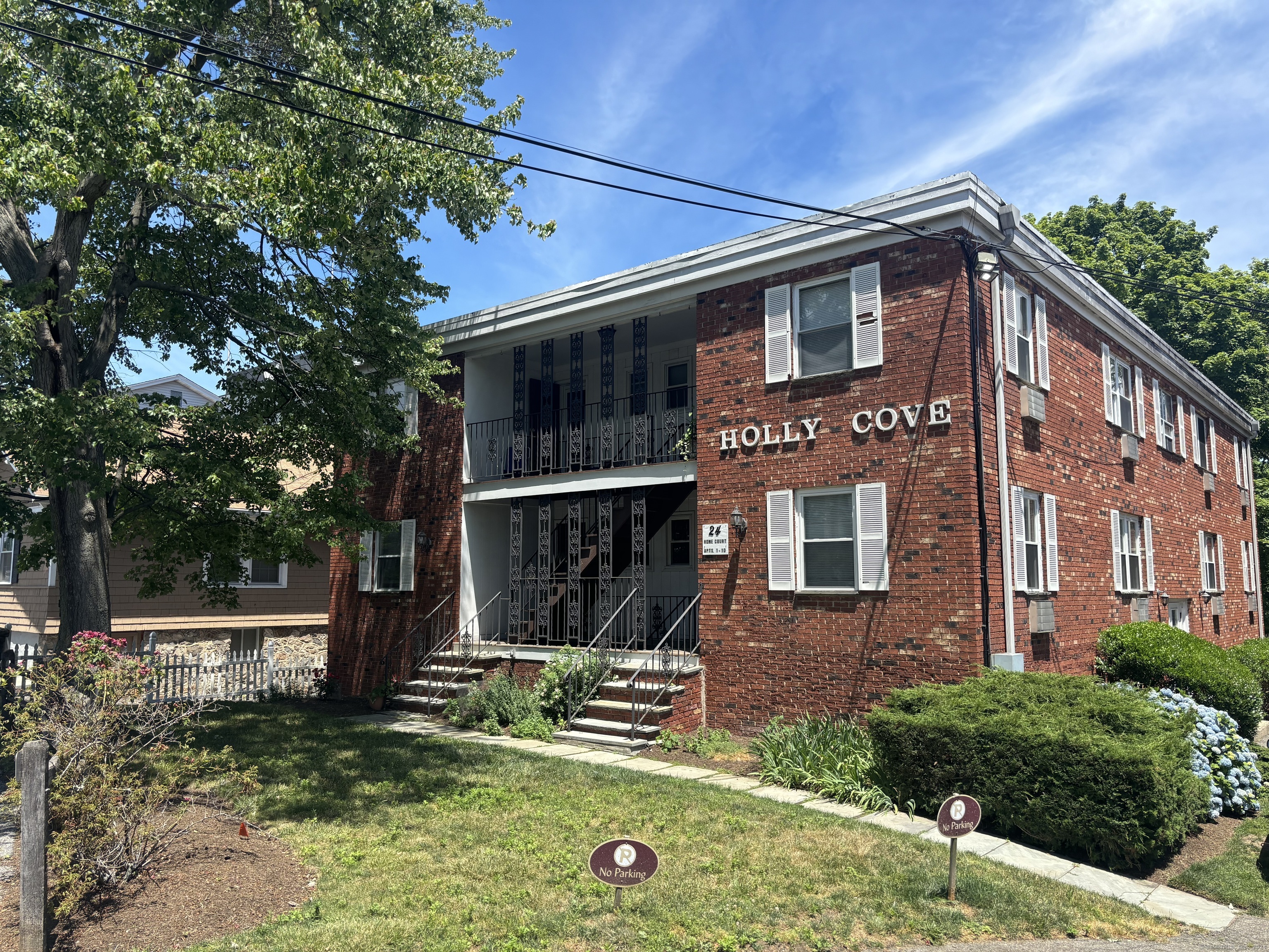 24 Home Court, Unit 4 Stamford, CT 06902 - Photo 1 of 1 front view of a house with a yard