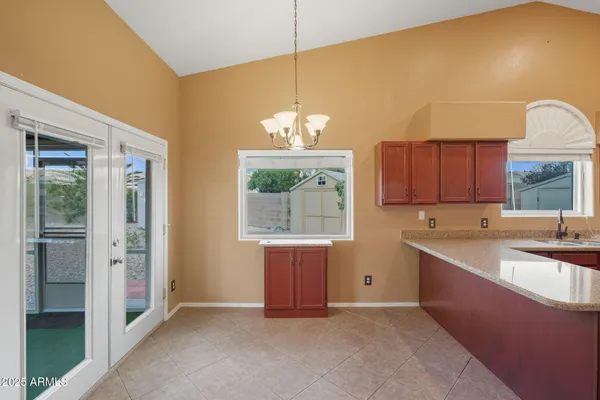 a kitchen with kitchen island a sink stove and refrigerator