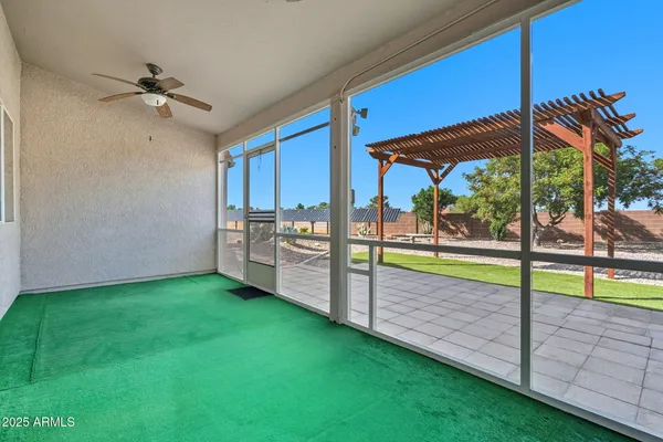 a view of a backyard with swimming pool