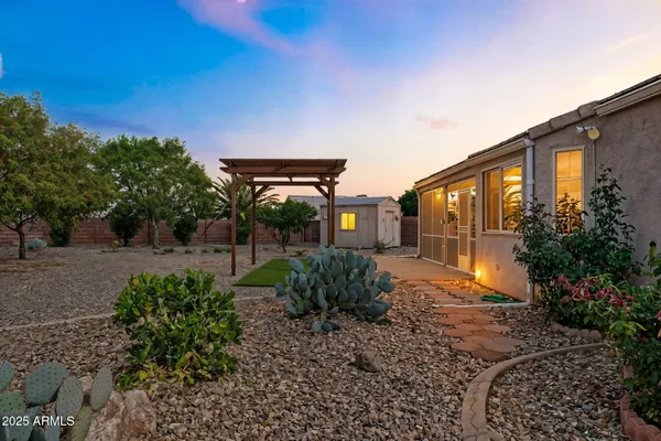a view of a garden with a bench in patio