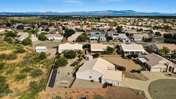 an aerial view of residential houses with outdoor space