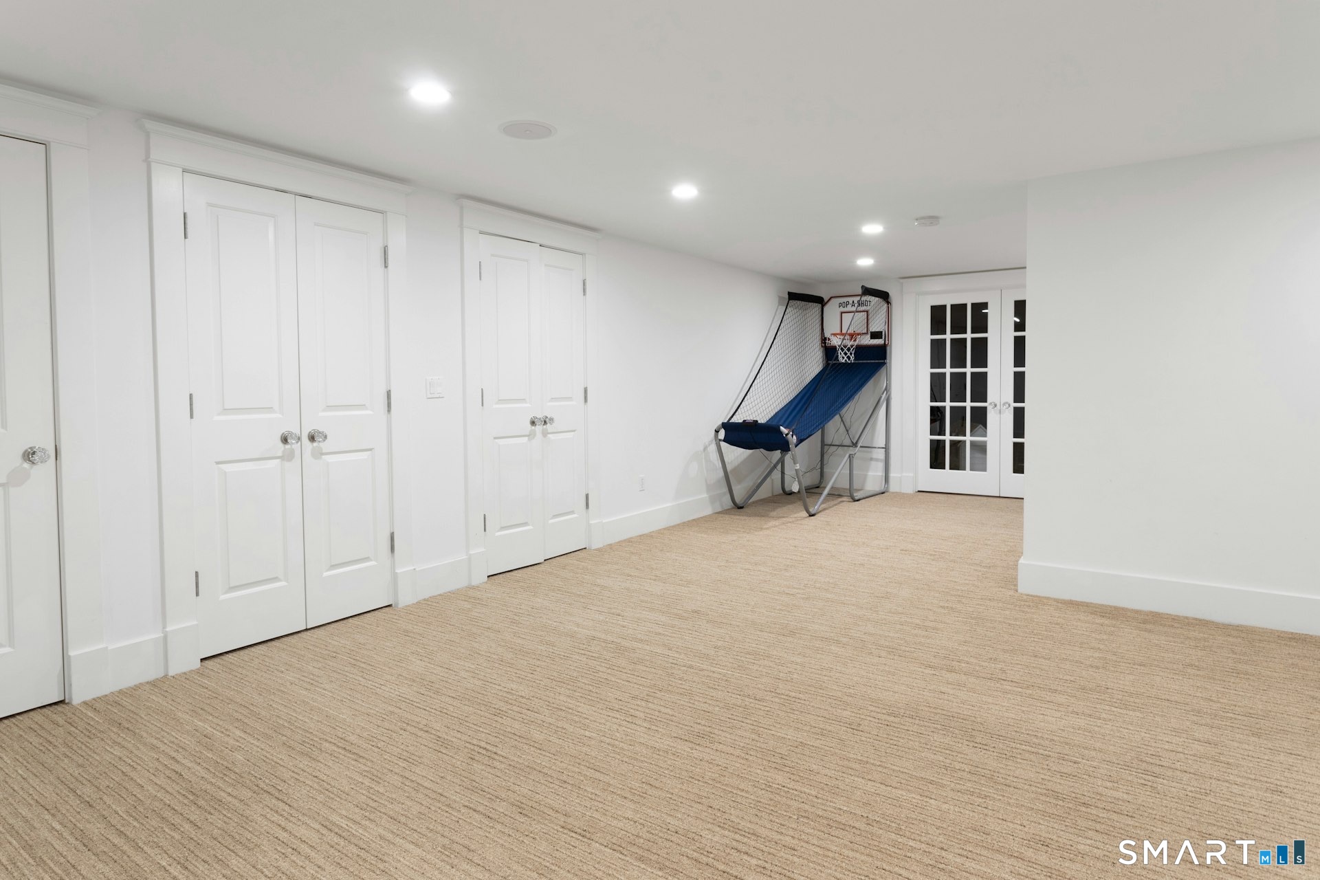 2 Roland Drive Darien, CT 06820 - Photo 35 of 40 a view of an empty room with wooden floor