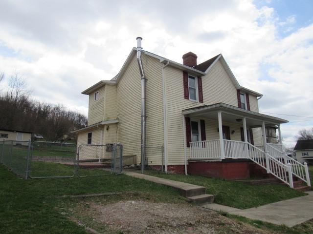 240 Main Street Dickerson Run, PA 15430 - Photo 3 of 20 a front view of a house with a garden