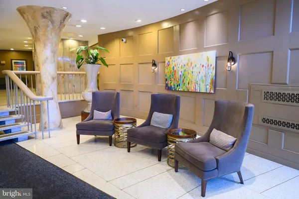 a work room with furniture and a rug