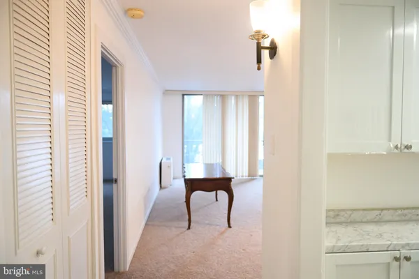 a view of a room with a wardrobe space