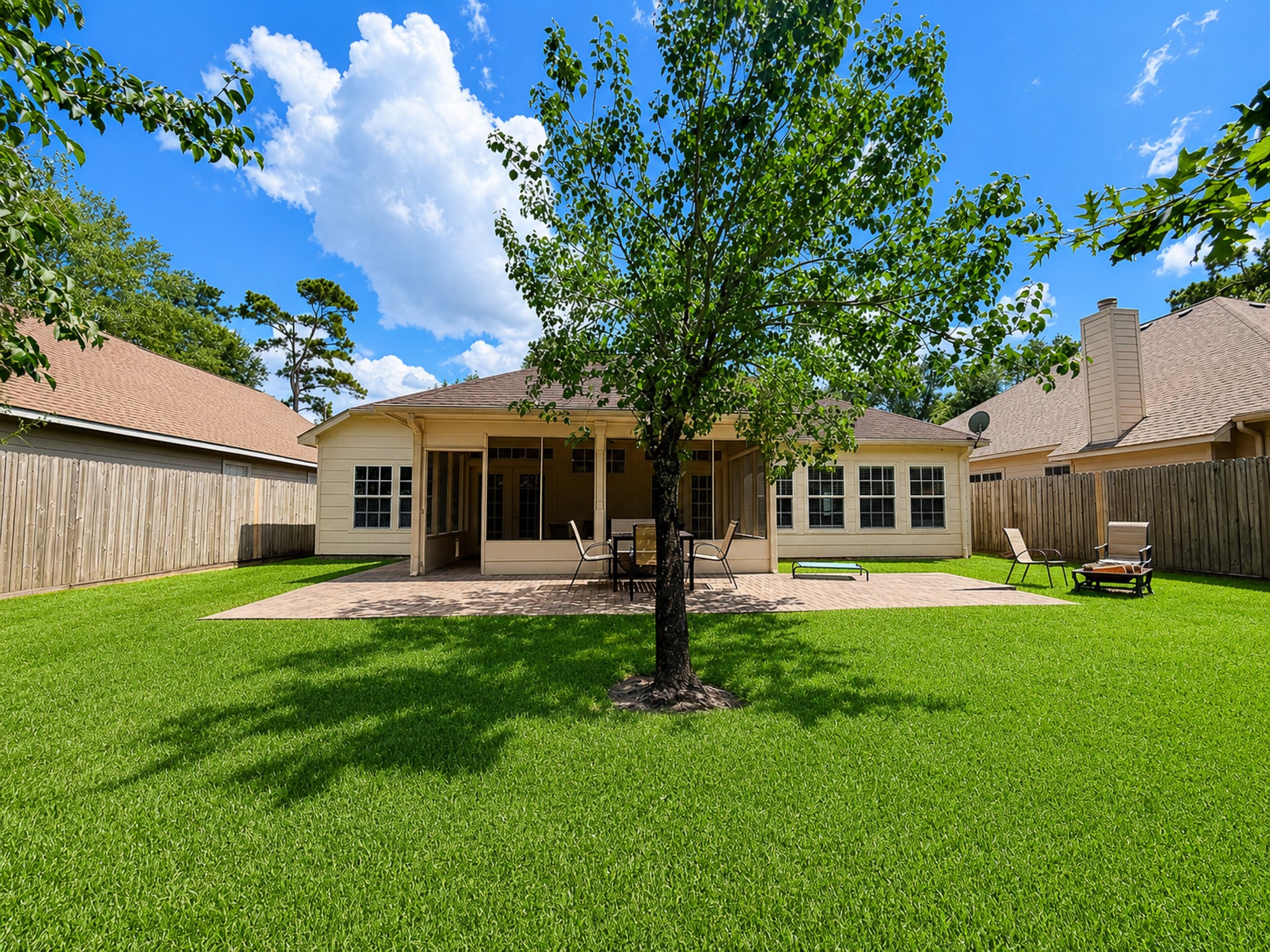 540 Springwood Drive Conroe, TX 77385 - Photo 22 of 23 Backyard offers pkenty of greenspace to make it your own. Add a pool, a playground or some chickens!