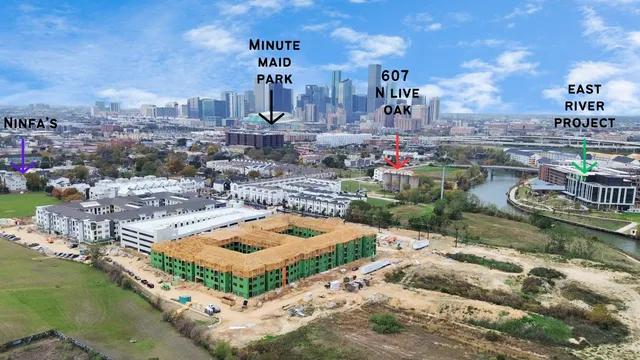 an aerial view of residential houses with outdoor space