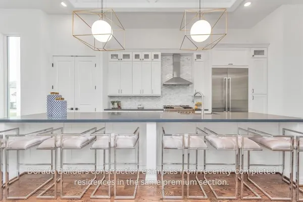a kitchen with white cabinets and a sink