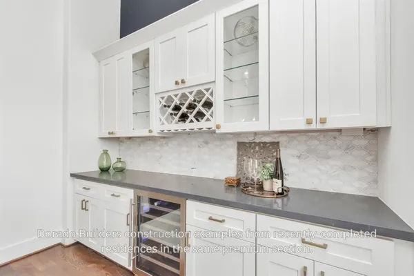 a large white kitchen with a large window