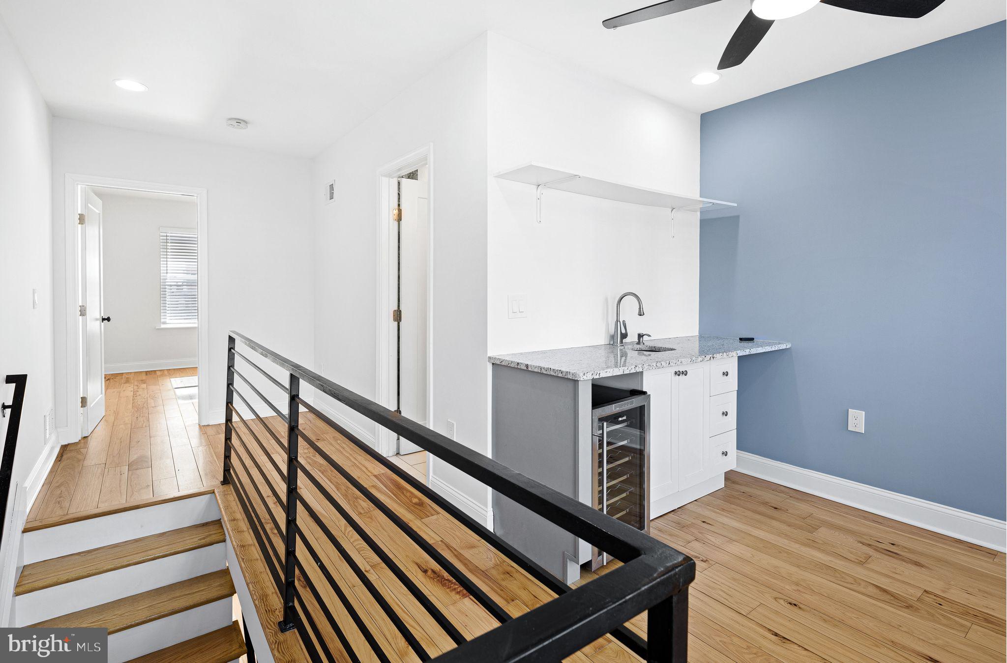 640 Emily Street Philadelphia, PA 19148 - Photo 3 of 15 a kitchen with sink microwave and stove
