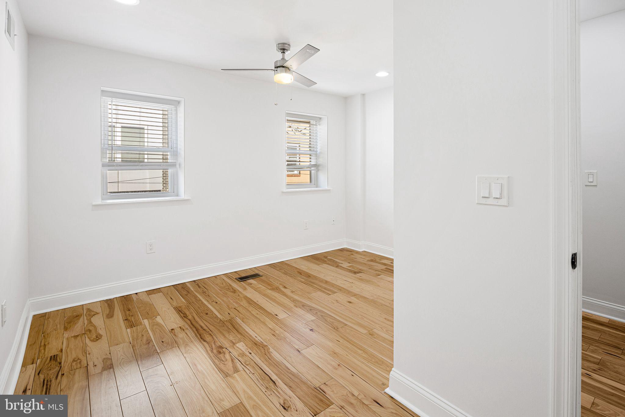640 Emily Street Philadelphia, PA 19148 - Photo 10 of 15 a view of empty room with wooden floor and fan