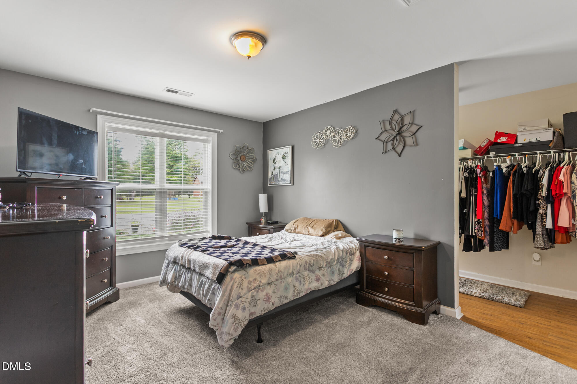3163 Saul Loop Road Elon, NC 27244 - Photo 28 of 44 a bedroom with a bed and a window