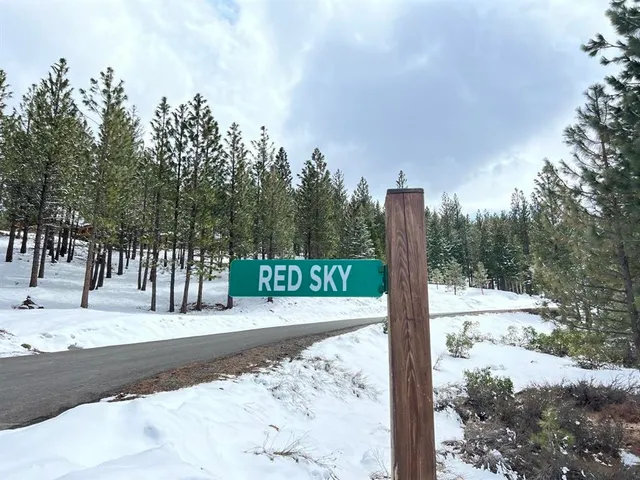 a swimming pool view with a seating space and a garden