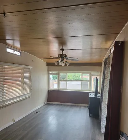 a view of room with window and hardwood floor