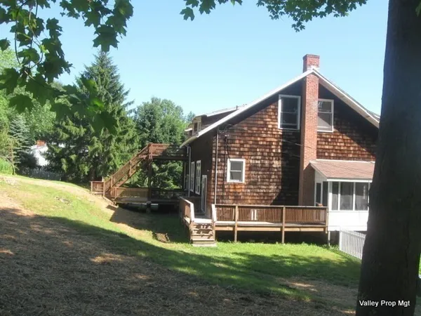 a view of a house with a yard