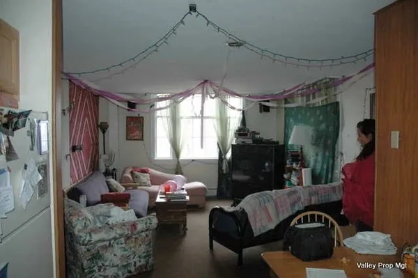a living room with furniture and a window