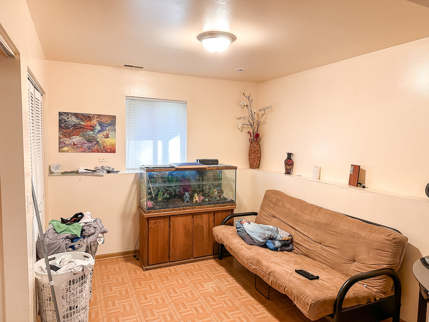 695 Moore Street Kankakee, IL 60901 - Photo 13 of 15 a living room with furniture and painting on the wall