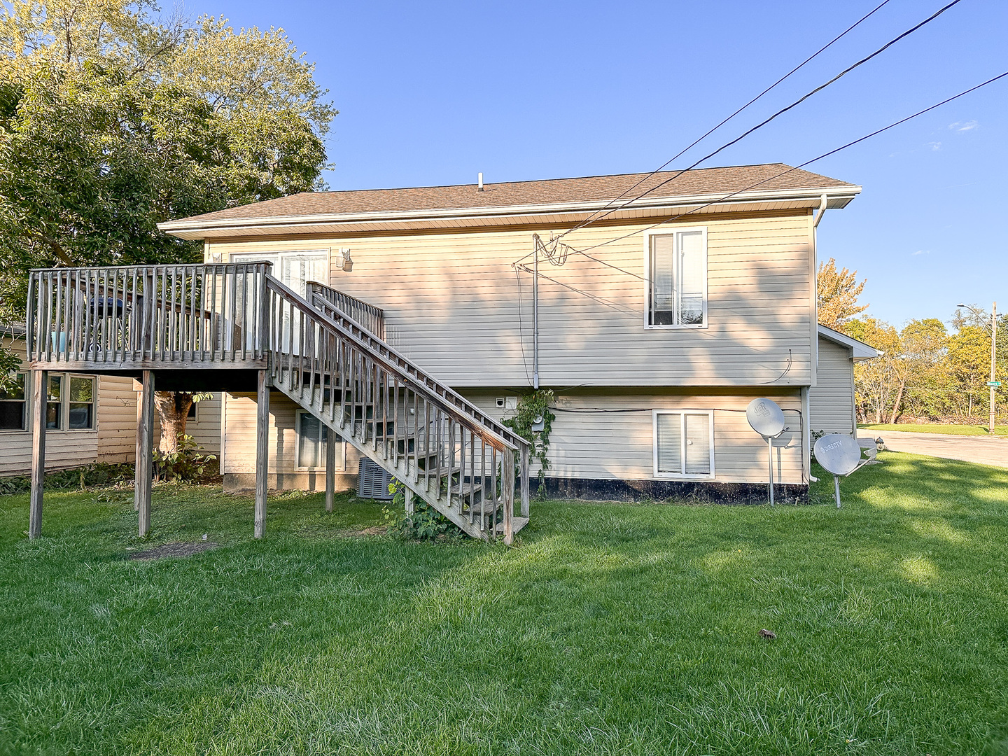 695 Moore Street Kankakee, IL 60901 - Photo 15 of 15 a view of yard with swimming pool and deck in the background