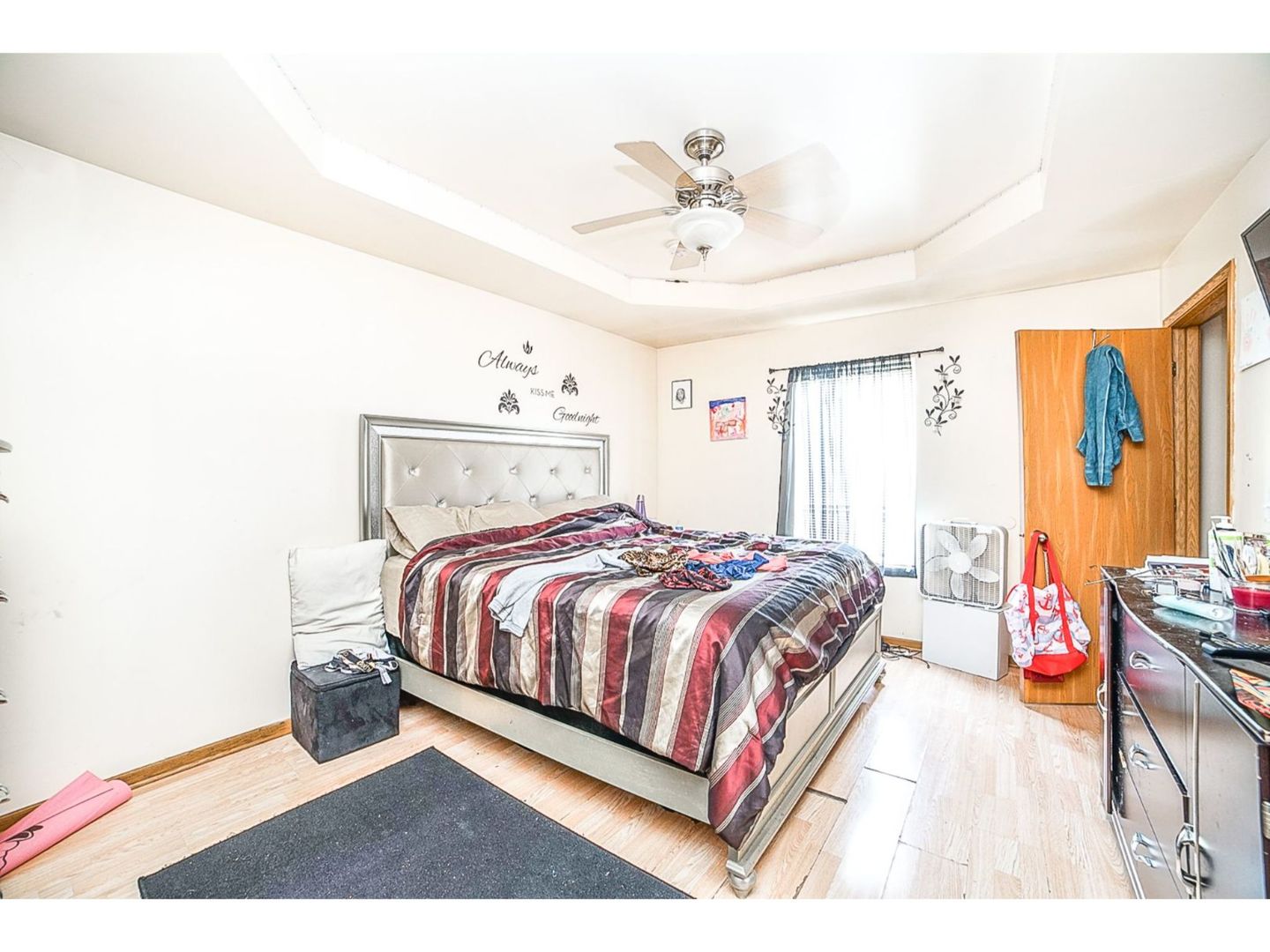 695 Moore Street Kankakee, IL 60901 - Photo 6 of 15 a spacious bedroom with a bed and a chandelier