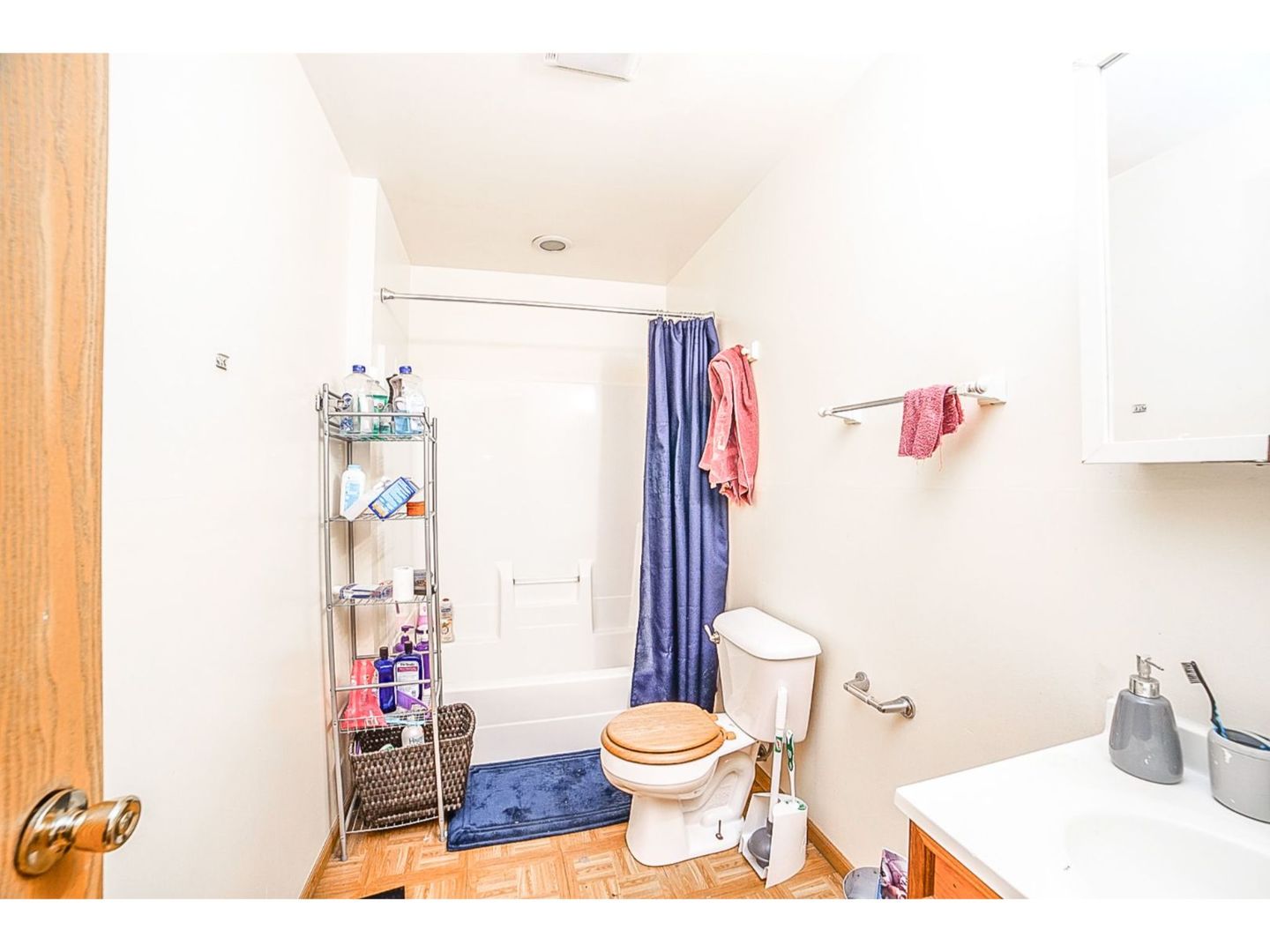 695 Moore Street Kankakee, IL 60901 - Photo 7 of 15 a bathroom with a toilet and a shower curtain