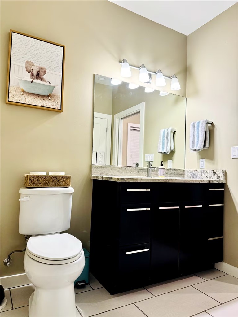 14310 Ridley Way Corpus Christi, TX 78418 - Photo 19 of 19 a bathroom with a toilet a sink and mirror