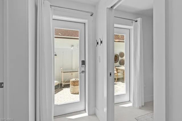 a view of a bathroom from a hallway