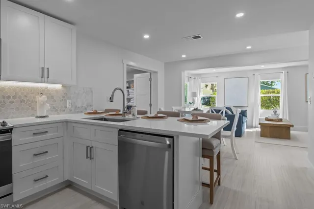 a kitchen with a sink and cabinets