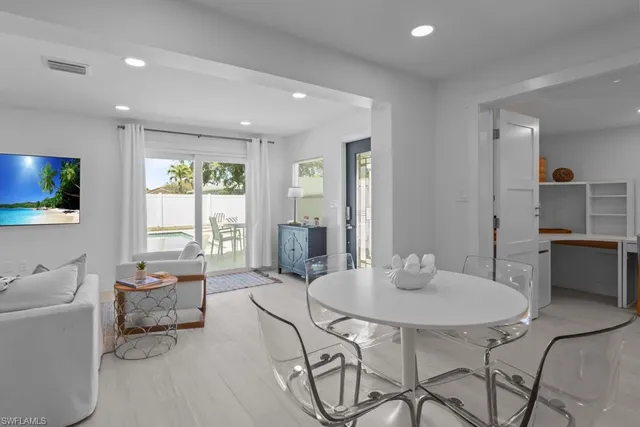 a living room with furniture and a table