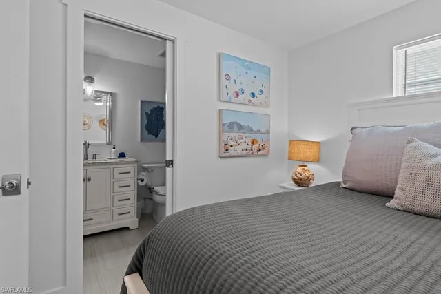 a bedroom with a bed and a dresser