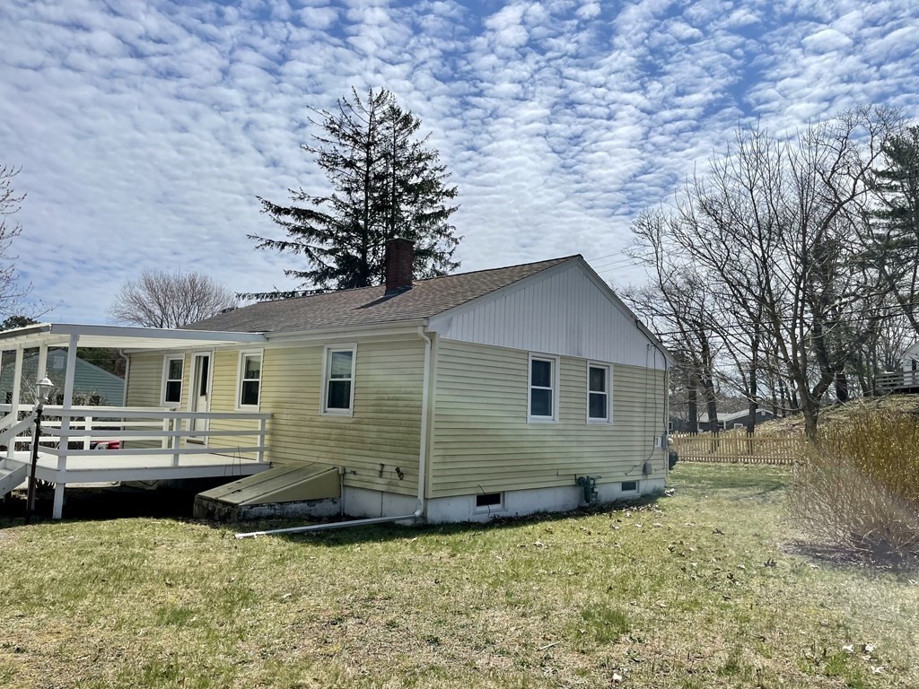 147 Puritan Road Bourne, MA 02532 - Photo 3 of 17 a view of a house with a patio