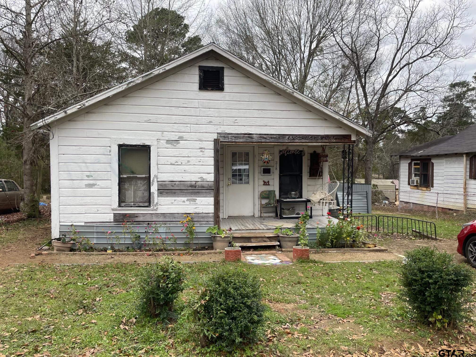 218 Beale Street Rusk, TX 75785 - Photo 1 of 1 a front view of a house with garden
