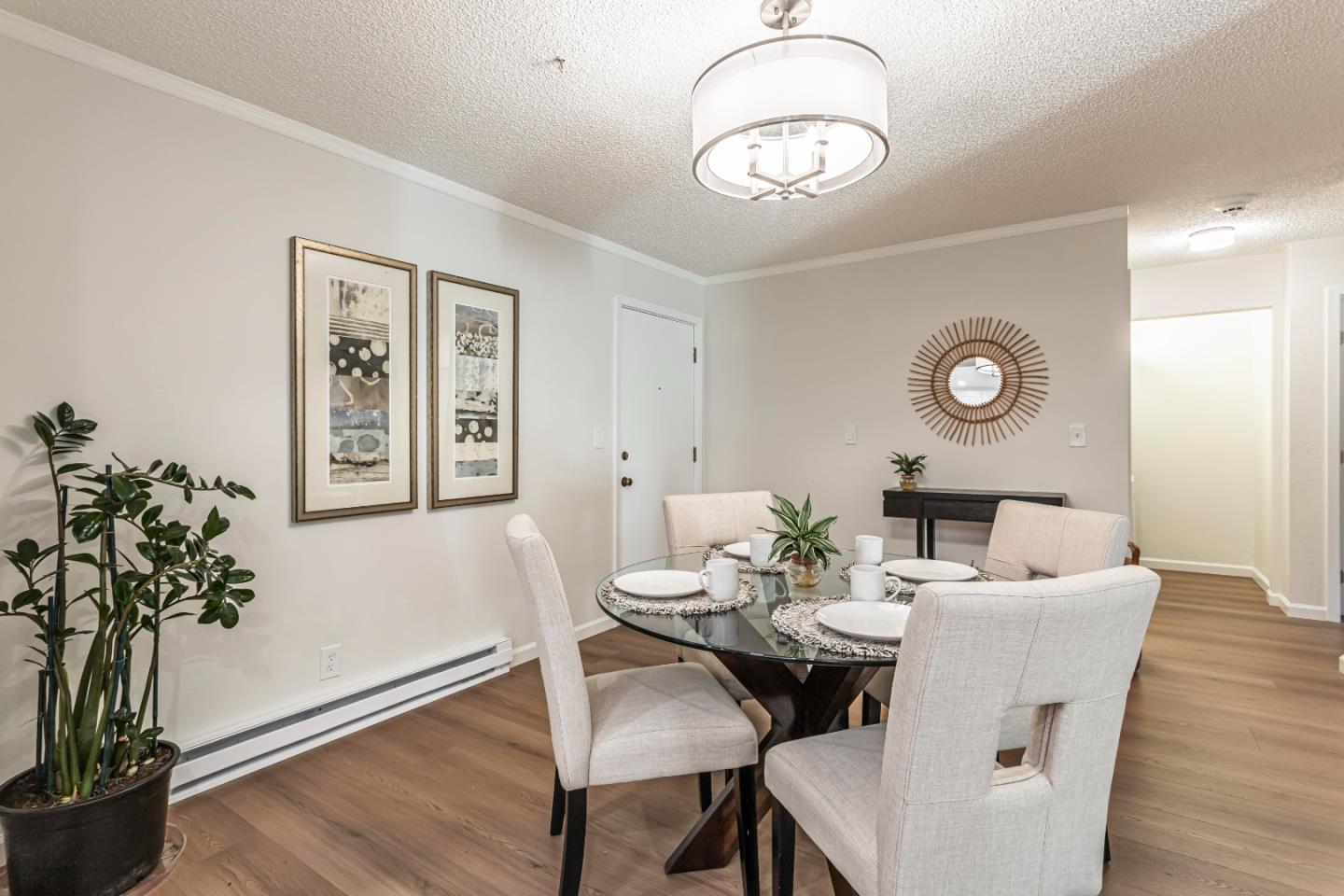1033 Crestview Drive, Unit 309 Mountain View, CA 94040 - Photo 14 of 50 a view of a dining room with furniture and wooden floor