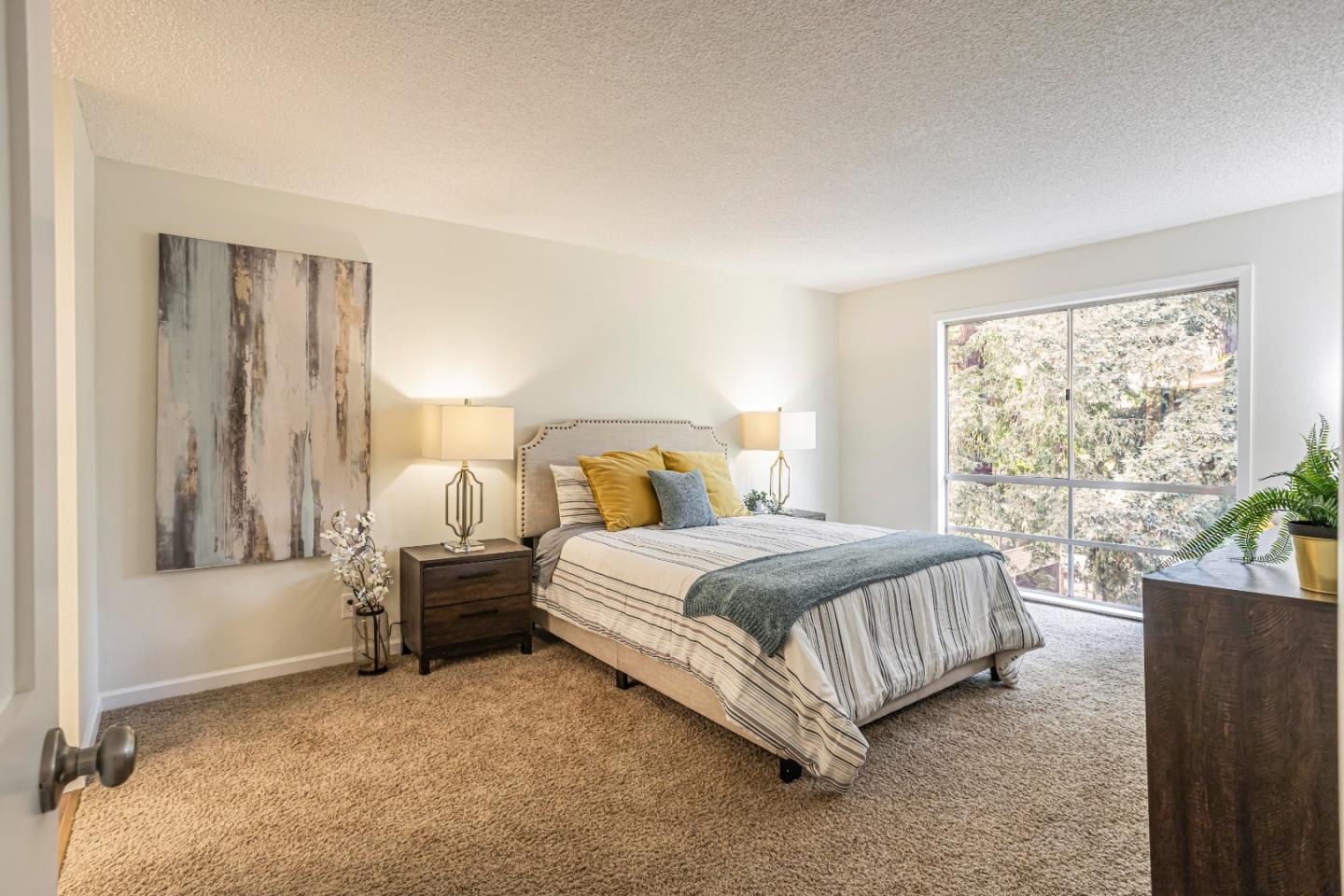 1033 Crestview Drive, Unit 309 Mountain View, CA 94040 - Photo 17 of 50 a spacious bedroom with a bed and a large window