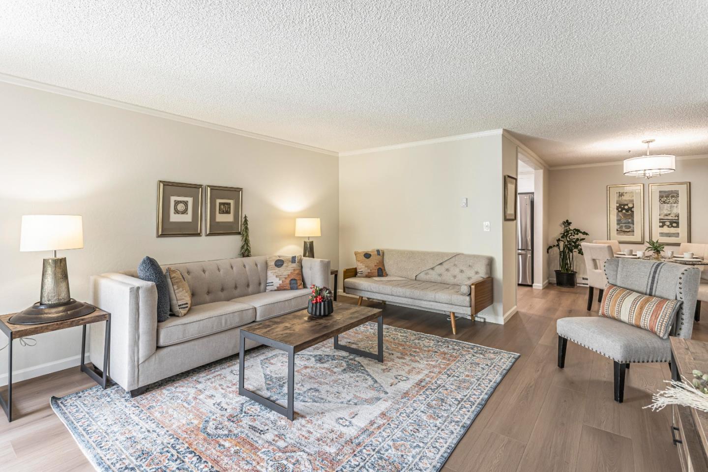 1033 Crestview Drive, Unit 309 Mountain View, CA 94040 - Photo 2 of 50 a living room with furniture and a lamp on table