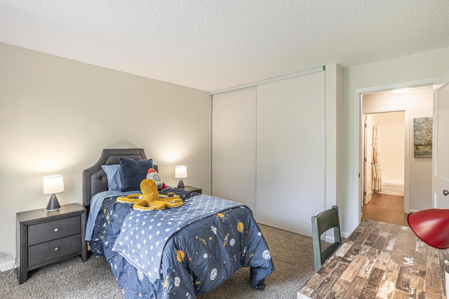 1033 Crestview Drive, Unit 309 Mountain View, CA 94040 - Photo 21 of 50 a bedroom with a bed and wooden floor