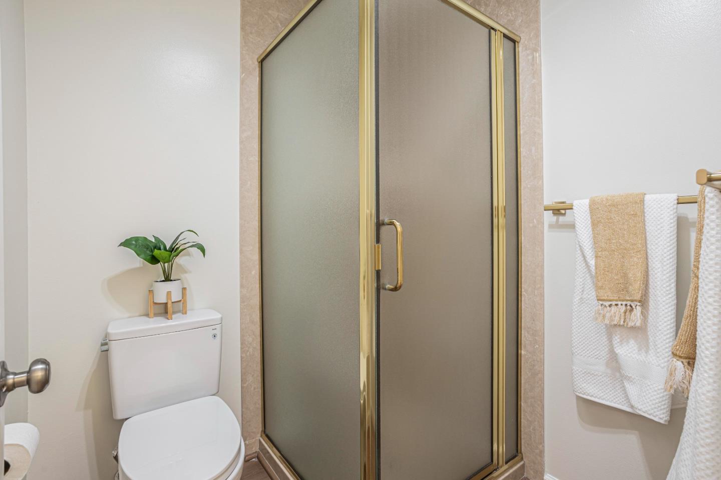 1033 Crestview Drive, Unit 309 Mountain View, CA 94040 - Photo 24 of 50 a white toilet sitting next to a bathroom sink