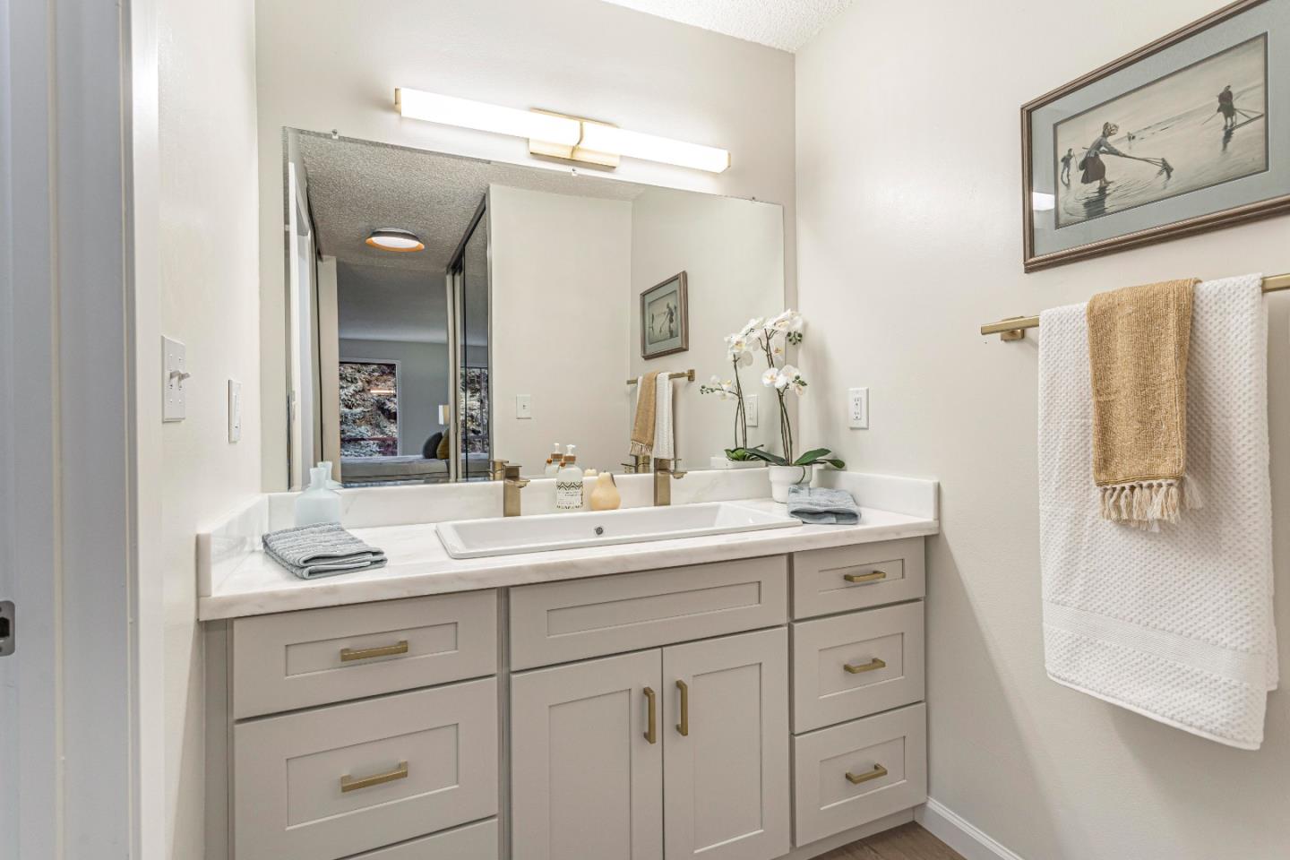 1033 Crestview Drive, Unit 309 Mountain View, CA 94040 - Photo 29 of 50 a bathroom with a double vanity sink mirror and