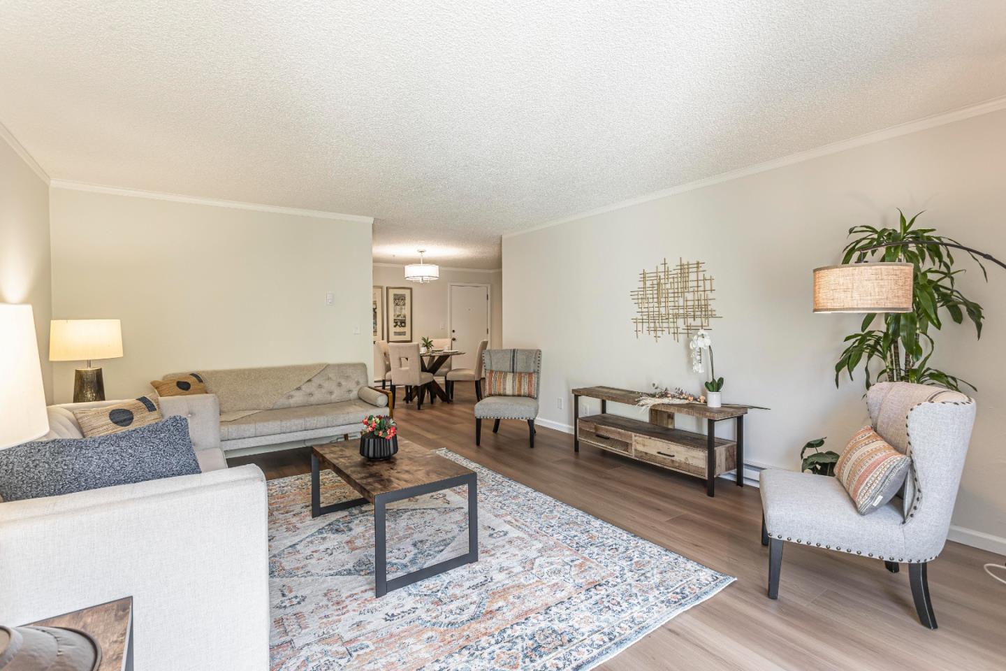 1033 Crestview Drive, Unit 309 Mountain View, CA 94040 - Photo 3 of 50 a living room with furniture and a rug