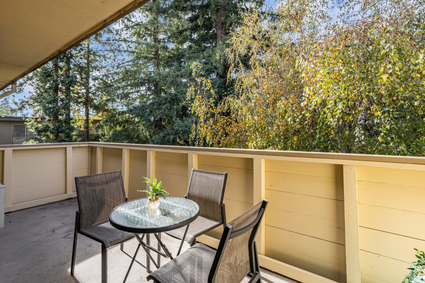 1033 Crestview Drive, Unit 309 Mountain View, CA 94040 - Photo 33 of 50 a balcony with a table and chairs