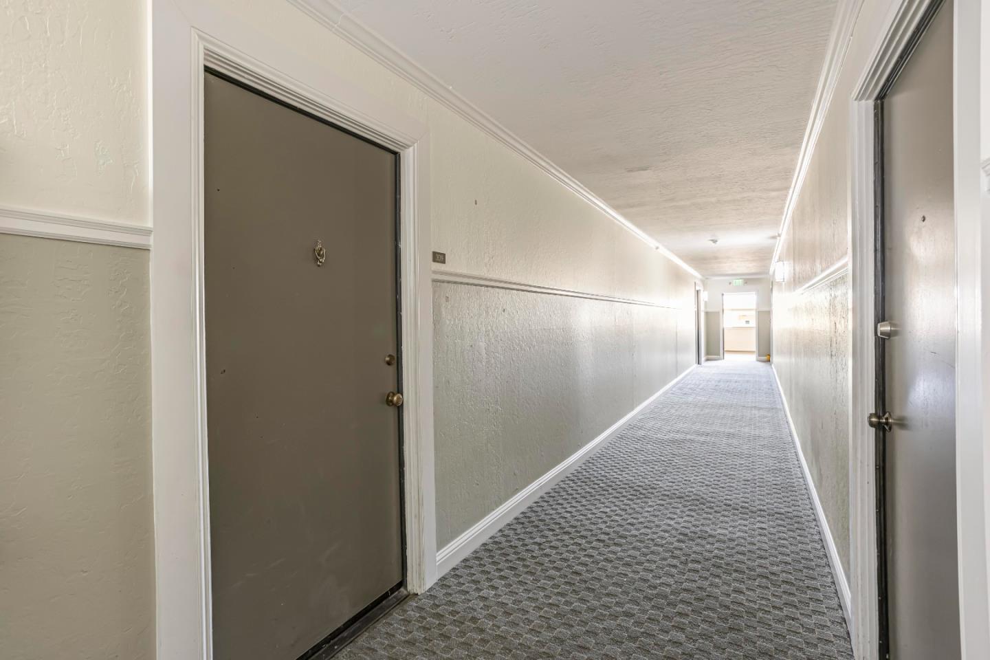 1033 Crestview Drive, Unit 309 Mountain View, CA 94040 - Photo 38 of 50 a view of hallway with wooden floor