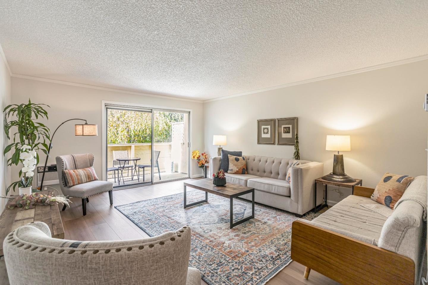 1033 Crestview Drive, Unit 309 Mountain View, CA 94040 - Photo 4 of 50 a living room with furniture and a large window